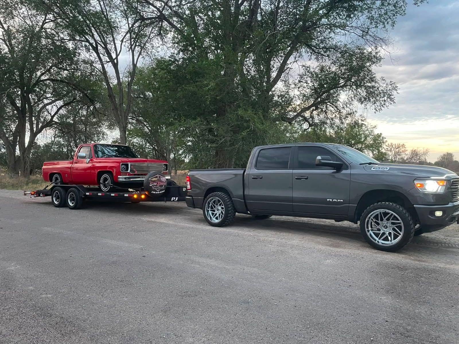 Classic red Chevrolet pickup transported by Gem State Haulers